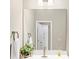 Bright bathroom featuring a large mirror, modern fixtures, and stylish decor at 5075 Briarstone Ridge Way, Alpharetta, GA 30022