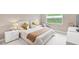 Comfortable bedroom with natural light, soft carpet, and neutral decor at 5075 Briarstone Ridge Way, Alpharetta, GA 30022