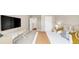 Stylish bedroom featuring a large TV, modern decor, and plush carpeting at 5075 Briarstone Ridge Way, Alpharetta, GA 30022