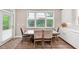 Cozy dining area with ample windows and stylish table setting at 5075 Briarstone Ridge Way, Alpharetta, GA 30022