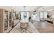 Open-concept dining room featuring stylish furnishings and seamless flow to the living space at 5075 Briarstone Ridge Way, Alpharetta, GA 30022