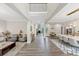The home's elegant foyer showcasing high ceilings and an open floor plan connecting living and dining areas at 5075 Briarstone Ridge Way, Alpharetta, GA 30022