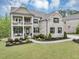 Stunning two-story home with a welcoming porch and meticulously landscaped front yard at 5075 Briarstone Ridge Way, Alpharetta, GA 30022