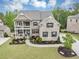 Charming two-story brick front home with a well-manicured lawn and inviting front porch at 5075 Briarstone Ridge Way, Alpharetta, GA 30022