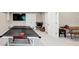 Spacious game room with ping pong table, television, and seating area at 5075 Briarstone Ridge Way, Alpharetta, GA 30022