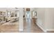 Open-concept hallway showcasing hardwood floors and access to the living and dining areas at 5075 Briarstone Ridge Way, Alpharetta, GA 30022