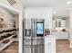 Kitchen featuring a stainless steel refrigerator with a screen and a walk-in pantry at 5075 Briarstone Ridge Way, Alpharetta, GA 30022