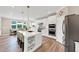 Open concept kitchen with island, stainless steel appliances and view of the dining nook at 5075 Briarstone Ridge Way, Alpharetta, GA 30022