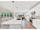 Bright, open kitchen with a large island, stainless steel appliances, and wood floors at 5075 Briarstone Ridge Way, Alpharetta, GA 30022