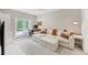 Inviting living room featuring a comfortable sectional and bright light at 5075 Briarstone Ridge Way, Alpharetta, GA 30022