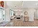 Inviting living room with hardwood floors and a cozy seating area under a modern light at 5075 Briarstone Ridge Way, Alpharetta, GA 30022