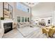 Bright and airy living room with tall ceilings, fireplace and open floor plan at 5075 Briarstone Ridge Way, Alpharetta, GA 30022