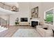 Spacious living room with fireplace, plush carpet and staircase to the second floor at 5075 Briarstone Ridge Way, Alpharetta, GA 30022