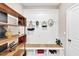 Mudroom features open shelves, cubbies with bench, and beadboard accent walls at 5075 Briarstone Ridge Way, Alpharetta, GA 30022