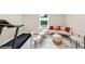 Bright sitting area features comfortable seating, unique chairs, and an exercise area for relaxation and fitness at 5075 Briarstone Ridge Way, Alpharetta, GA 30022