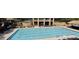 Resort-style community pool with lounge chairs and cabana with grilling area at 5075 Briarstone Ridge Way, Alpharetta, GA 30022
