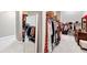 Large walk-in closet featuring ample storage and a full length mirror at 5075 Briarstone Ridge Way, Alpharetta, GA 30022