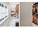 Large walk-in closet featuring a window and shelving with plenty of storage space at 5075 Briarstone Ridge Way, Alpharetta, GA 30022