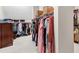 Generous walk-in closet showcasing abundant storage and open shelving for clothes and accessories at 5075 Briarstone Ridge Way, Alpharetta, GA 30022