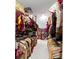 Spacious walk-in closet with racks full of clothes, shelves, and organizational bins at 5075 Briarstone Ridge Way, Alpharetta, GA 30022