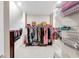 Organized walk-in closet with shelves, hanging rods, and ample storage space at 5075 Briarstone Ridge Way, Alpharetta, GA 30022