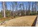 Large backyard with well-maintained lawn and stone pathway, perfect for outdoor activities at 2109 Rugby Ave, Atlanta, GA 30337