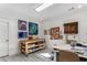 Bright and airy craft room featuring ample workspace and natural light from two windows at 2109 Rugby Ave, Atlanta, GA 30337