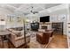 Cozy living room featuring a fireplace, beamed ceilings, and comfortable seating at 2109 Rugby Ave, Atlanta, GA 30337
