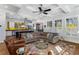 Inviting living room open to kitchen featuring an island with barstools and an eat-in area at 2109 Rugby Ave, Atlanta, GA 30337