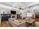 Bright living room with fireplace, exposed beams, modern furniture, and beautiful hardwood floors at 2109 Rugby Ave, Atlanta, GA 30337