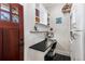 Compact home office nook featuring a built-in desk, shelves, and natural light at 2109 Rugby Ave, Atlanta, GA 30337