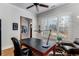 Well-lit office space featuring a large desk, shuttered windows, and comfortable seating at 2109 Rugby Ave, Atlanta, GA 30337