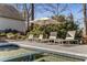 Relaxing pool area with lounge chairs and umbrella, perfect for outdoor entertaining at 2109 Rugby Ave, Atlanta, GA 30337