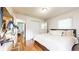Comfortable bedroom with hardwood floors, closet, and desk featuring bright modern fixtures at 2413 Hunting Valley Dr, Decatur, GA 30033