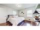 Cozy bedroom featuring hardwood floors, light colored walls, and bright natural light at 2413 Hunting Valley Dr, Decatur, GA 30033