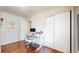 Bright bedroom featuring wood floors, closet, and modern desk at 2413 Hunting Valley Dr, Decatur, GA 30033