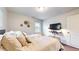 Comfortable bedroom with hardwood floors, with tv and lighting on decorative shelf at 2413 Hunting Valley Dr, Decatur, GA 30033