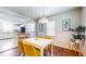 Open dining room and kitchen with stainless steel appliances and seating at the island at 2413 Hunting Valley Dr, Decatur, GA 30033