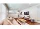 Bright living room featuring hardwood floors, stylish decor, and a comfortable seating area at 2413 Hunting Valley Dr, Decatur, GA 30033