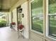 Welcoming front porch with brick facade, potted flowers, and stylish lighting at 2413 Hunting Valley Dr, Decatur, GA 30033