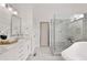 Spa bathroom features a large shower, a soaking tub, and double marble vanity at 6185 Deerwoods Trl, Alpharetta, GA 30005