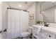 Clean bathroom with a white vanity, toilet, and shower with curtain at 6185 Deerwoods Trl, Alpharetta, GA 30005