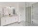 Bright bathroom features a large shower, double vanity, and shiplap walls at 6185 Deerwoods Trl, Alpharetta, GA 30005