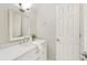 Bright bathroom features a marble countertop vanity and modern lighting at 6185 Deerwoods Trl, Alpharetta, GA 30005
