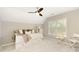 Bright bedroom with vaulted ceilings featuring a white day bed, soft neutral decor, and plush carpet at 6185 Deerwoods Trl, Alpharetta, GA 30005