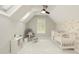 Bright Bedroom with vaulted ceiling, floral wallpaper, a rocking chair, and a white crib at 6185 Deerwoods Trl, Alpharetta, GA 30005
