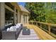 An expansive deck with wicker seating and outdoor living space at 6185 Deerwoods Trl, Alpharetta, GA 30005