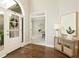 Bright foyer featuring hardwood floors and a welcoming entrance at 6185 Deerwoods Trl, Alpharetta, GA 30005