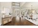 Spacious foyer with hardwood floors, elegant staircase, and ample natural light at 6185 Deerwoods Trl, Alpharetta, GA 30005