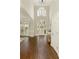 Grand two-story foyer with large windows and beautiful hardwood flooring at 6185 Deerwoods Trl, Alpharetta, GA 30005